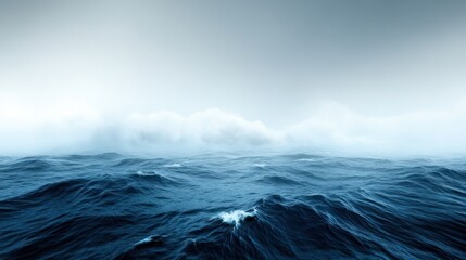 Expansive ocean view with misty clouds above, evoking tranquility.