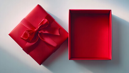 Empty open red gift box with red ribbon bow on white background, flat lay, top view, product placement