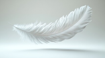 Obraz premium A delicate white feather floating against a soft, neutral background.