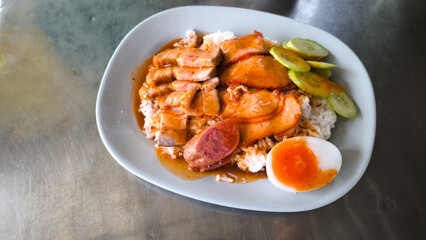 Red pork and crispy pork on rice, food in Thailand
