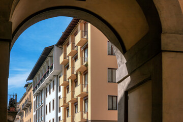 Fototapeta premium The charming streets of Florence, the unique stone buildings and architectural details under the bright blue sky, capturing the essence of Tuscany.