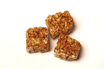 Jipang or berondong is indonesian traditional snack. Made from rice, corn coated with sweet caramel. Isolated white background