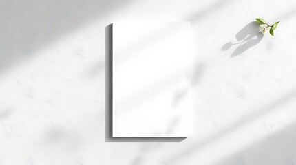 Blank Book Mockup:  A blank book mockup with a natural light effect  on a marble background. The book has a subtle shadow.  