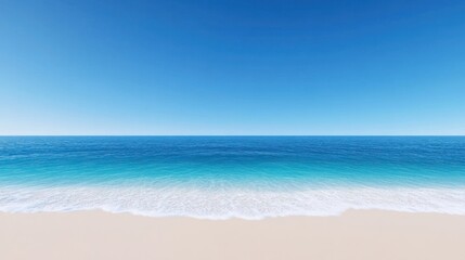 Fototapeta premium Tranquil beach scene with clear blue sky and gentle waves.