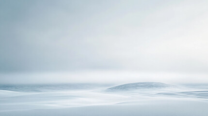 Endless snow-covered landscape with muted sky and distant hills