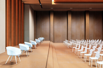 Modern conference hall interior with empty seats and a stage, featuring a spacious design and luxurious wooden paneling. 3D Rendering