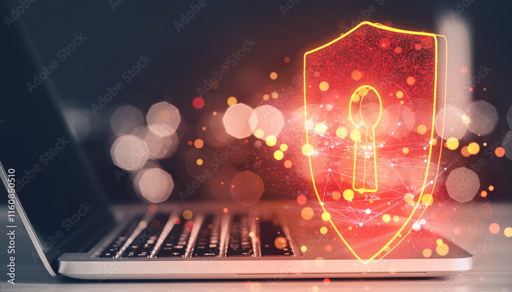Poster shield hologram with keyhole symbol displayed above laptop keyboard on desk, representing cybersecur