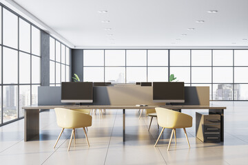 Modern office interior with desks, chairs, and computers in a bright open space with large windows and a city view in daylight. 3D Rendering