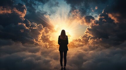 Fototapeta premium Inspiring businesswoman expecting success beneath radiant light dreamlike cloudscape visual art empowering atmosphere motivational view