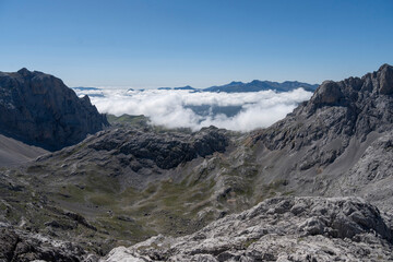 Rocky mountains with clouds sea in Picos de Europa Spain
