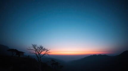 Naklejka premium A serene twilight landscape featuring a solitary tree against a gradient sky transitioning from deep blue to warm orange hues.
