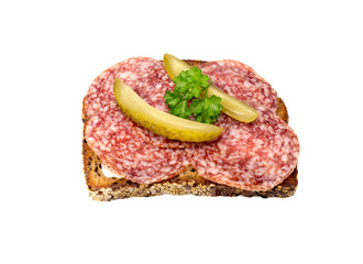 Wholemeal bread slice with salami and pickled cucumbers on transparent background