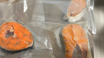 red delicious healthy fish lies in thermal bags on the table and is cooked in seasonings for baking, plastic is not good for food