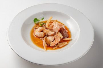 Steamed shrimp with mushrooms and bamboo, traditional Chinese dish isolated on white background