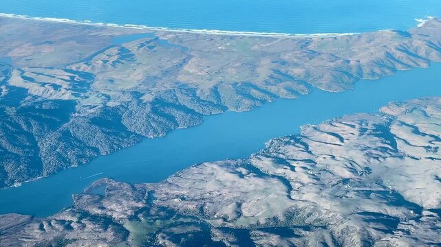 An Aerial Vew of Mountains, Sea and River