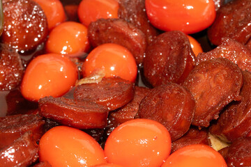 Close Up of Fried Chorizo Cured Meat And Tomatoes