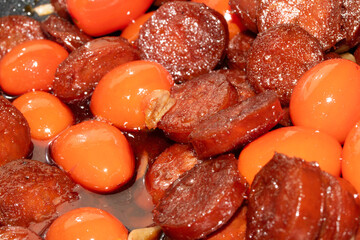 Close Up of Fried Chorizo Cured Meat And Tomatoes