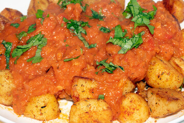 Close up of Porato Tapas Roasted Tomato auce Bravas