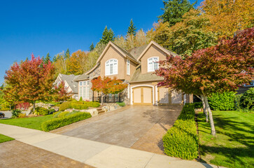 Fototapeta premium Two story luxury house with beautiful summer landscape in Vancouver, Canada, North America. Day time on June 2024.