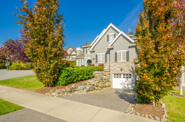 Two story luxury house with beautiful summer  landscape in Vancouver, Canada, North America. Day time on June 2024.
