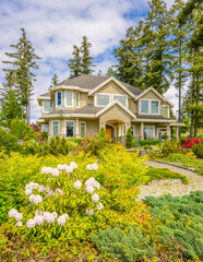 Two story luxury house with beautiful summer  landscape in Vancouver, Canada, North America. Day time on June 2024.