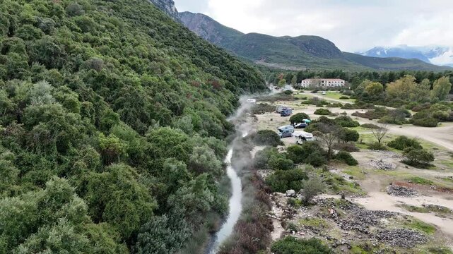 Drone Flight Over Thermal Spring and Campervans Near King Leonidas Memorial in Greece