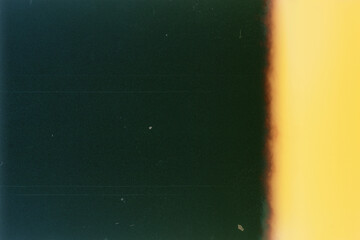 Blank grained film strip texture background with heavy grain, dust and light leak