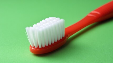 Toothbrush with White Bristles on Vibrant Green Background for Dental Care Concept