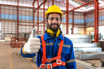 Portrait Caucasian factory worker man thumbs up happy with successful work