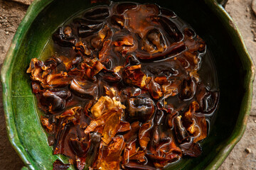 Guajillo chile from Oaxaca soaked after roasting to prepare a mole coloradito red in Mexico.