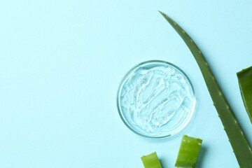 Petri dish, cosmetic gel swatches  with aloe on color background, copy space. Bio science research, biochemistry, organic skin care concept