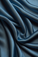 Fototapeta premium Exquisite silk fabric texture. Soft folds and delicate shine. Perfect for backdrops, design and fashion projects. Elegant and luxurious look