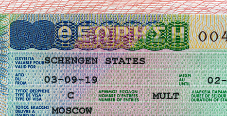 Obraz premium Close-up of a Schengen visa with detailed security features.