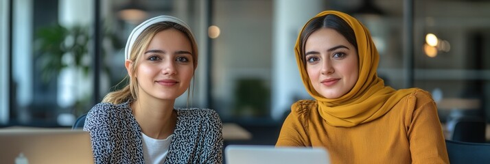Cultural Exchange in Innovation, Two women from diverse backgrounds collaborating on a digital startup's vision in a contemporary workspace