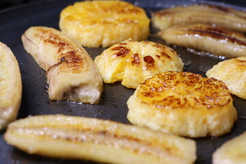 Deliciously Grilled Bananas and Pineapple Slices Cooked Perfectly on a Skillet for Great Flavor