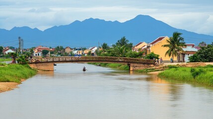 Naklejka premium Tranquil river scene with a small bridge, houses, mountains, and a lone boatman.