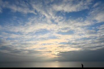 jogger running along the coast