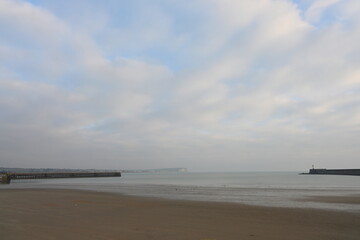 newhaven harbour walls with Seaford head in the distance