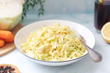 A bowl with coleslow salad