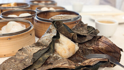 Photo of Steamed delicacies served in bamboo baskets, showcasing traditional Chinese dim sum cuisine. Concept of Chinese new year, lunar year, dim sum, dumpling, authenticity, celebration