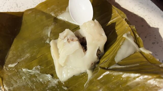 Palm Leaf Pie. Vietnamese food in palm leaf. Vietnamese street food, served in green palm leaves in Ba Be National Park.
