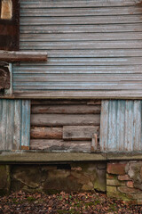 Weathered wall with peeling paint and cracked bricks