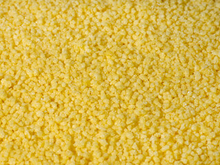 Couscous is wheat groats, a product of processing wheat groats. A healthy side dish with carbohydrates and fiber. close-up