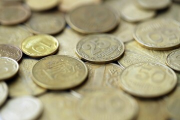 Big pile of different coins from various time period in Ukraine. Shiny Ukrainian money background