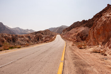 A road with a yellow line down the middle