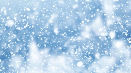 Obraz premium Snowfall on a blue background, ideal for winter-themed projects