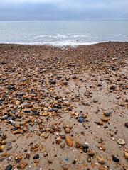Pebble and sandy beach along the coast in Hove, Sussex