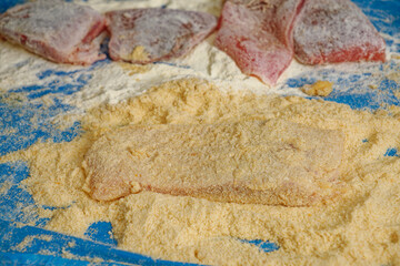 Breaded raw carp fish