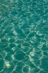 Sun glitter of blue water