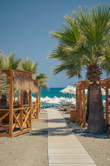 Resort Corner with Palm Trees and Wooden Gazebos